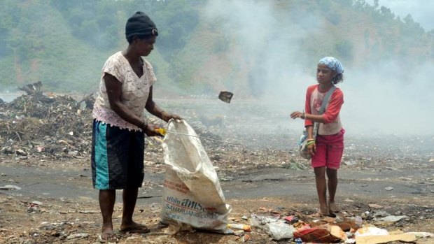 Madalena Soares and her niece eke out a living from the piles of rubbish at the tip.