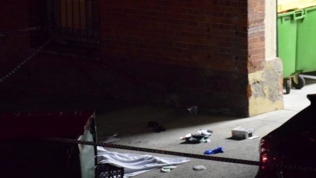 Marcus Volke's body covered with a blanket in Dath Street, Teneriffe. 