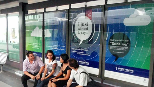 Signs at the Royal Brisbane and Women's Hospital busway urge people to chat to strangers.