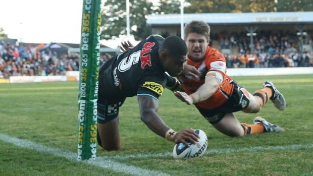 Kevin Naiqama touches down for the Panthers against the Tigers at Leichhardt Oval last weekend.