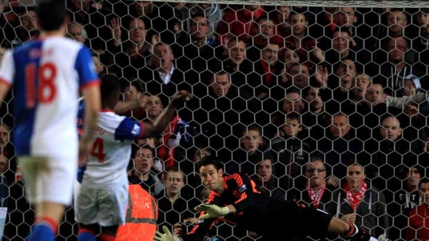 Super save: Liverpool's Australian goalkeeper Brad Jones is about to stop the penalty strike by Blackburn's Yakubu.