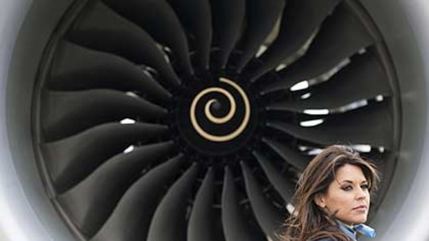 Model Daniella Lineker stands in front of the Boeing 787 Dreamliner aircraft at Farnborough airport.