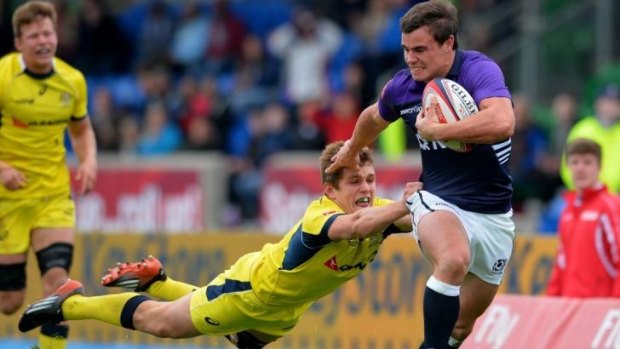 Escape: Tom Lucas of Australia can't stop Lee Jones of Scotland scoring the match-sealing try.