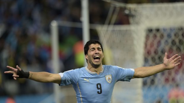 Double trouble ... Uruguay's forward Luis Suarez celebrates after scoring against England.