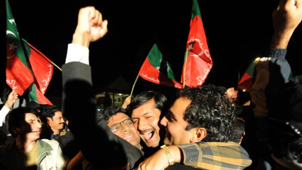 Jubilant lawyers and opposition party activists outside the Islamabad home of  Supreme Court Justice  Iftikhar Chaudhry, celebrating the decision to reinstate Mr Chaudhry and about 60 other judges sacked by former president  Pervez Musharraf in 2007.