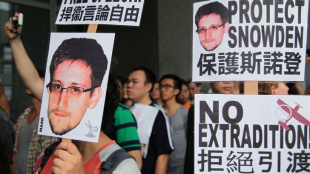 Freedom: Hong Kong residents show their support for Edward Snowden during a rally outside the government's offices.