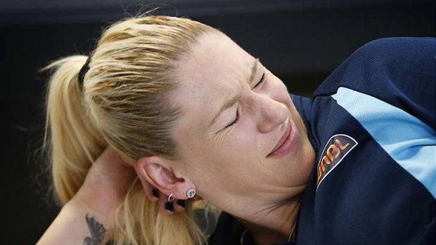 Canberra Capital Lauren Jackson reacts as acupuncture needles are removed during treatment at the Sports Science Sports Medicine HUB at the AIS.