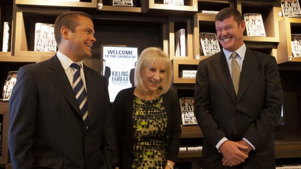 Lachlan Murdoch (left) and James Packer ham it up with author Pamela Williams.