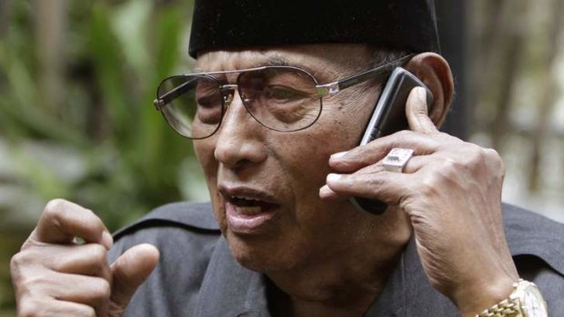 Sultan of Sulu Jamalul Kiram III talks on a mobile phone to his brother Prince Agbimudin, one of the leaders of about 1000 armed men holed up in a village in the Malaysian state of Sabah.  Kiram III said that his group's stand-off demands are the recognition of the Sultan of Sulu and Sabah as the rightful owner of the land, and a renegotiation of the original terms of its lease with a British trading company.
