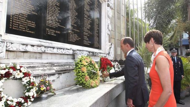 Prime Minister Tony Abbott and wife Margie lay a wreath during a ceremony in remembrance of Bali bombing victims, in Bali on Wednesday.