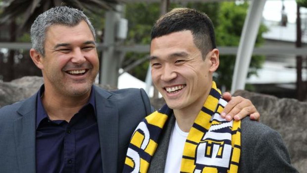 Ready for action: Central Coast Mariners player  Kim Seung-yong and his coach Phil Moss.