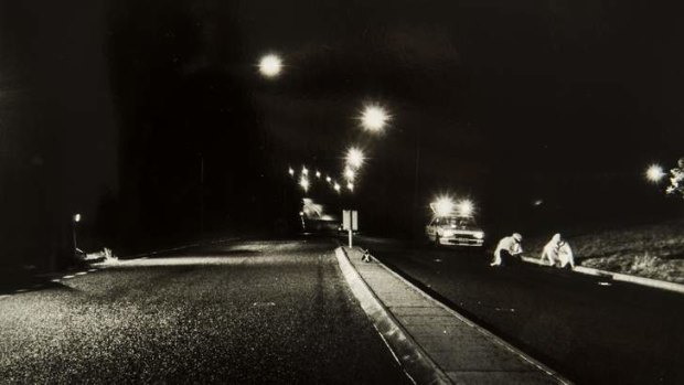 A photograph showing a body on the road, from the coronial inquest into the death of Troy Forsyth, who was killed in a hit and run in Kent Street, Deakin, on March 1, 1987.