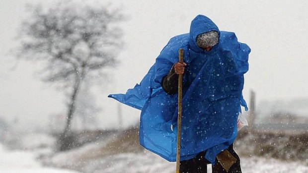 A pilgrim braves the elements in Ibeas de Juarros, near Burgos, as he walks the "Way of St. James", a Christian pilgrimage which treks across northern spain to the tomb of St James the Greater.