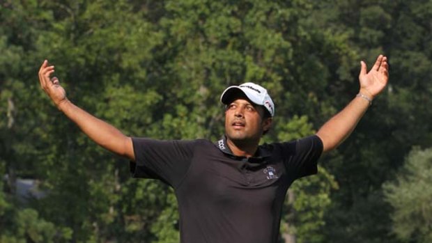Ecstatic ... Arjun Atwal celebrates his maiden US PGA win.