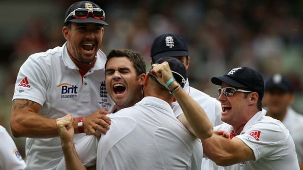 The champion: James Anderson is mobbed by teammates after dismissing Michael Hussey in the fourth Test at the MCG on Boxing Day in 2010.