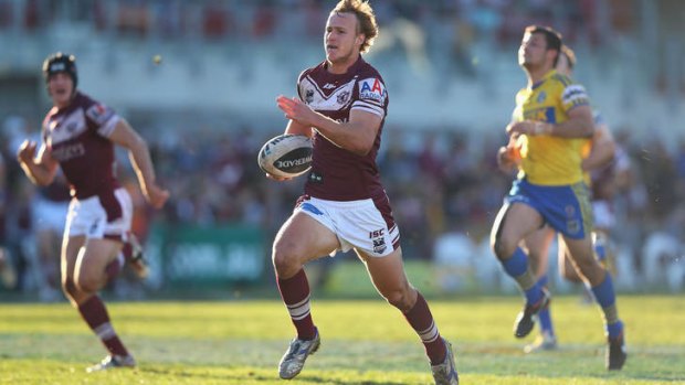 Flying Eagle ... Manly's Daly Cherry-Evans makes a break against Parramatta.