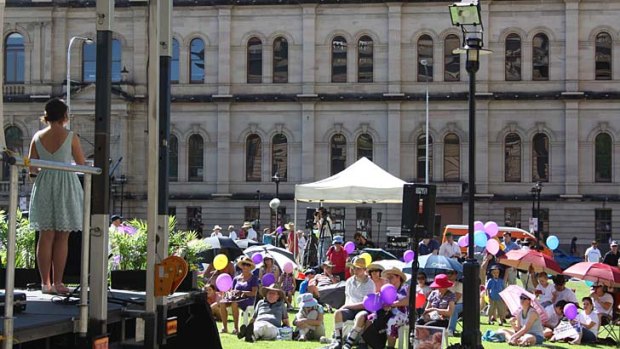 A woman speaks to pro-choice advocates at a protest in Brisbane.