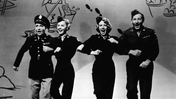 Singer Rosemary Clooney, second from right, dances with, from left to right, Bing Crosby, Vera-Ellen, and Danny Kaye in the film <i>White Christmas</i>.