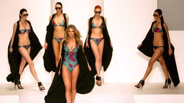 Model citizens ... Jennifer Hawkins, wearing  swimmers from her own label Cozi, leads the way  at the Myer show yesterday.