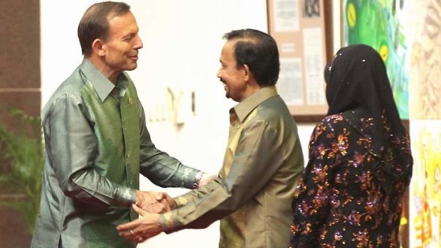 Sultan of Brunei Haji Hassanal Bolkiah greets Prime Minister Tony Abbott last October.