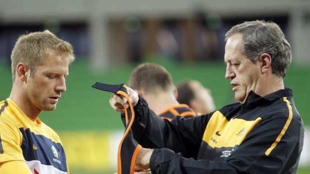 Australian midfielder Vince Grella with Australian team doctor Peter Brukner.