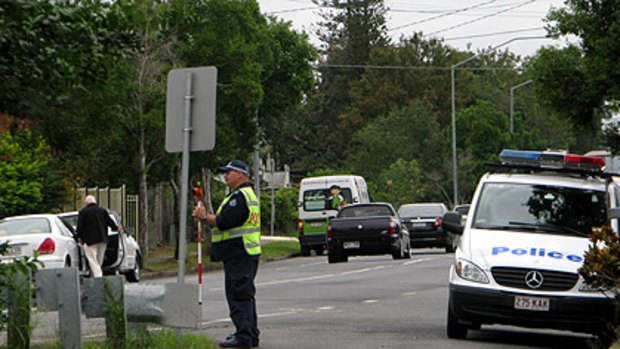 Police at the scene of the tragedy in south Brisbane yesterday.