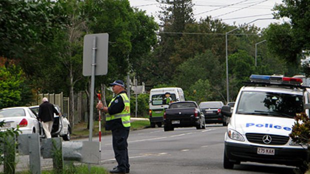 Police at the scene of the tragedy today.