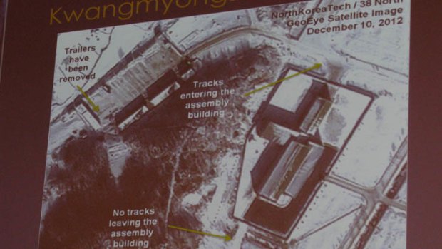 A slide shows tyre tracks at a satellite launch site, which indicated when it was bout to be launched.
