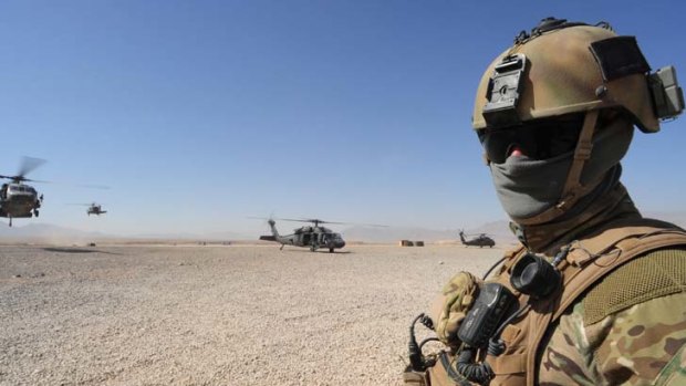 On duty ... an Australian soldier in Tarin Kowt. US Army criticism has undermined a flattering Australian report on Afghan soldiers in a battle there in July.