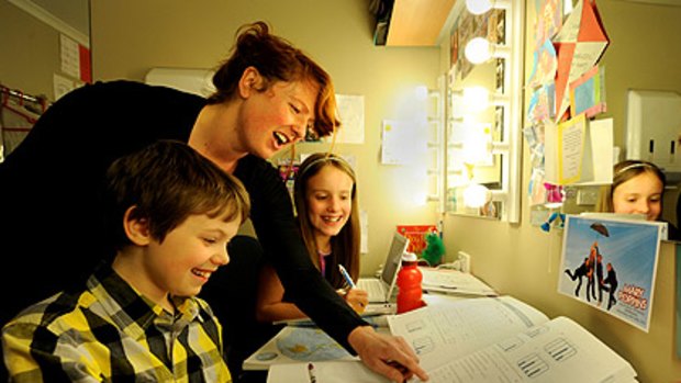 Hitting the books backstage: two of the 10 child actors from the Mary Poppins musical, Hayley Edwards and Kurtis Papadinis, in their dressing-room classroom with tutor Isobel Baynes.