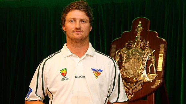 Jackson Bird of the Tasmanian Tigers with his Bupa Sheffield Shield Player of the Year award at the 2012 State Cricket Awards.