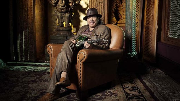 Soundtrack for a siesta: Even in his downtime, Santana is never far from a six-string.