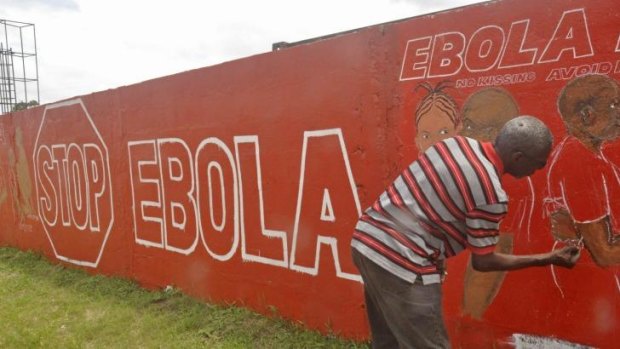 Art against Ebola: A local Liberian artist paints a mural.
