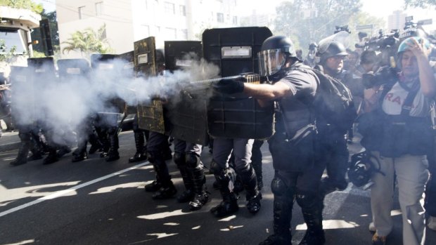 Police fire rubber bullets at protesters in Sao Paulo on Thursday.