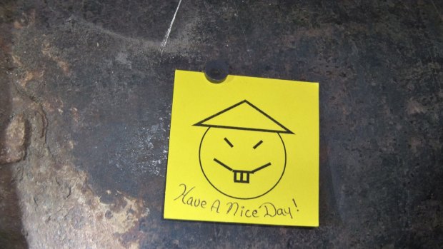 A note with a caption "Have a nice day" left on an opening in the pipe, where two inmates are suspected to have cut open as part of their escape from Clinton Correctional Facility.