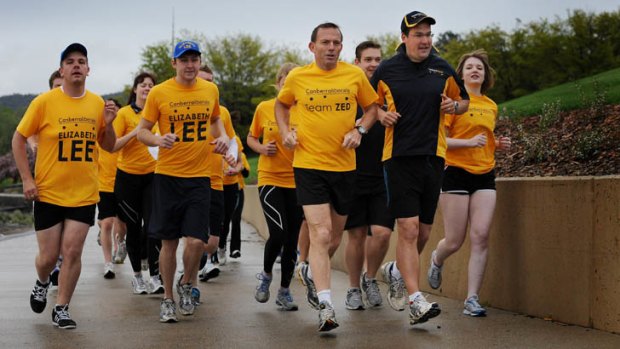 Tony Abbott took a morning run with Canberra Liberals leader Zed Seselja and his team around Lake Burley Griffin.