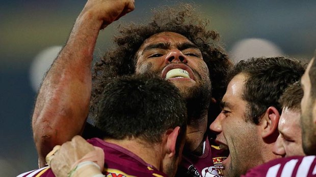 Sam Thaiday and the Maroons celebrate a try in game two.