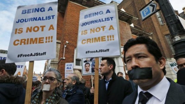 Journalists demonstrate across the street from Egypt's embassy in central London.