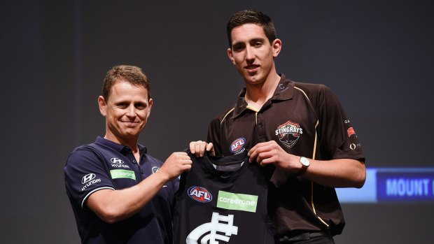 Carlton coach Brendon Bolton with the number one draft pick Jacob Weitering last year.