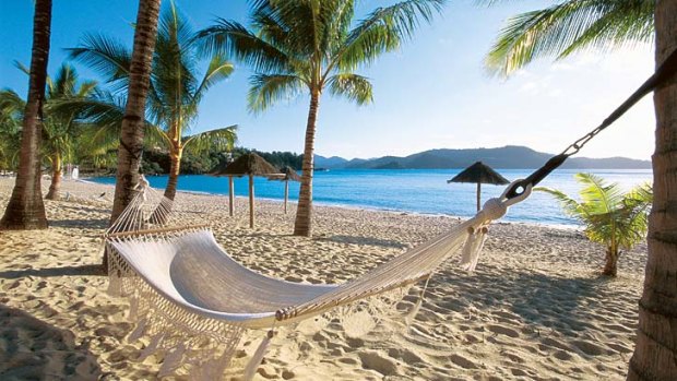 Tropical outlook... peak hour at Hamilton Island's Catseye Beach.