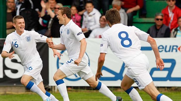 Fair dinkum talent ... Brad Smith, centre, celebrates scoring a goal for England at the under-17 European Championships in Serbia.