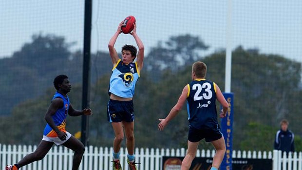 Take your pick ... Jake Barrett takes a mark for the NSW/ACT under 16s team. He has chosen to play AFL instead of rugby league.