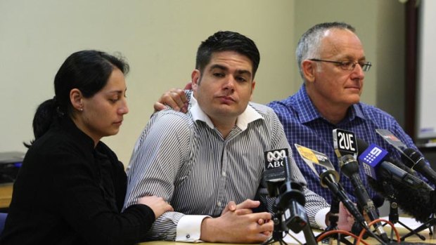 Gary Logan (right), son of crash victims Donald and Patricia Logan, and Robert Logan (centre), son of Calvyn Logan, with his wife.