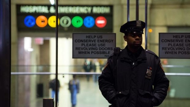 A policeman stands at the entrance to New York's Bellevue Hospital after the city's first case of Ebola was confirmed. 