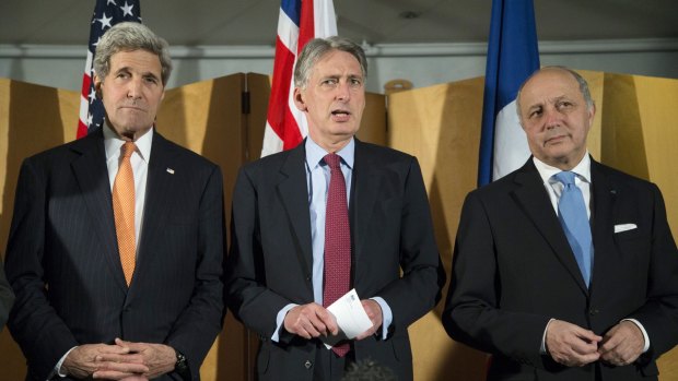 Negotiating with Iran ... British Foreign Secretary Philip Hammond, centre, flanked by US Secretary of State John Kerry, left, and French Foreign Minister Laurent Fabius.