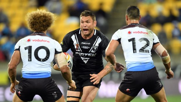 Moving forward?: Jared Waerea-Hargreaves charges into Eloni Vunakece and Brayden Wiliame.