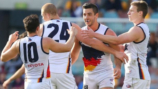 The Crows celebrate a goal.