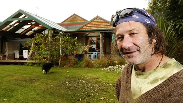 Robert Moloney and the mudbrick house he used to call home on a bush block.