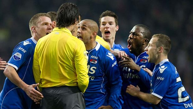 Angry ... AZ Alkmaar players protest to the referee after their goalkeeper Esteban was sent off.