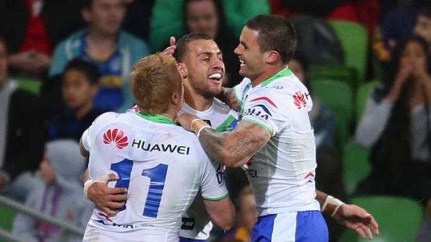 Upset of the season: Raiders players celebrate victory against Melbourne Storm on Saturday.